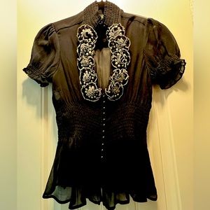 Sheer shirt bottom all the way up to the neck.